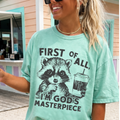 First of All I’m God’s Masterpiece Shirt | Faith Graphic Tee for Women | Christian Raccoon T-Shirt